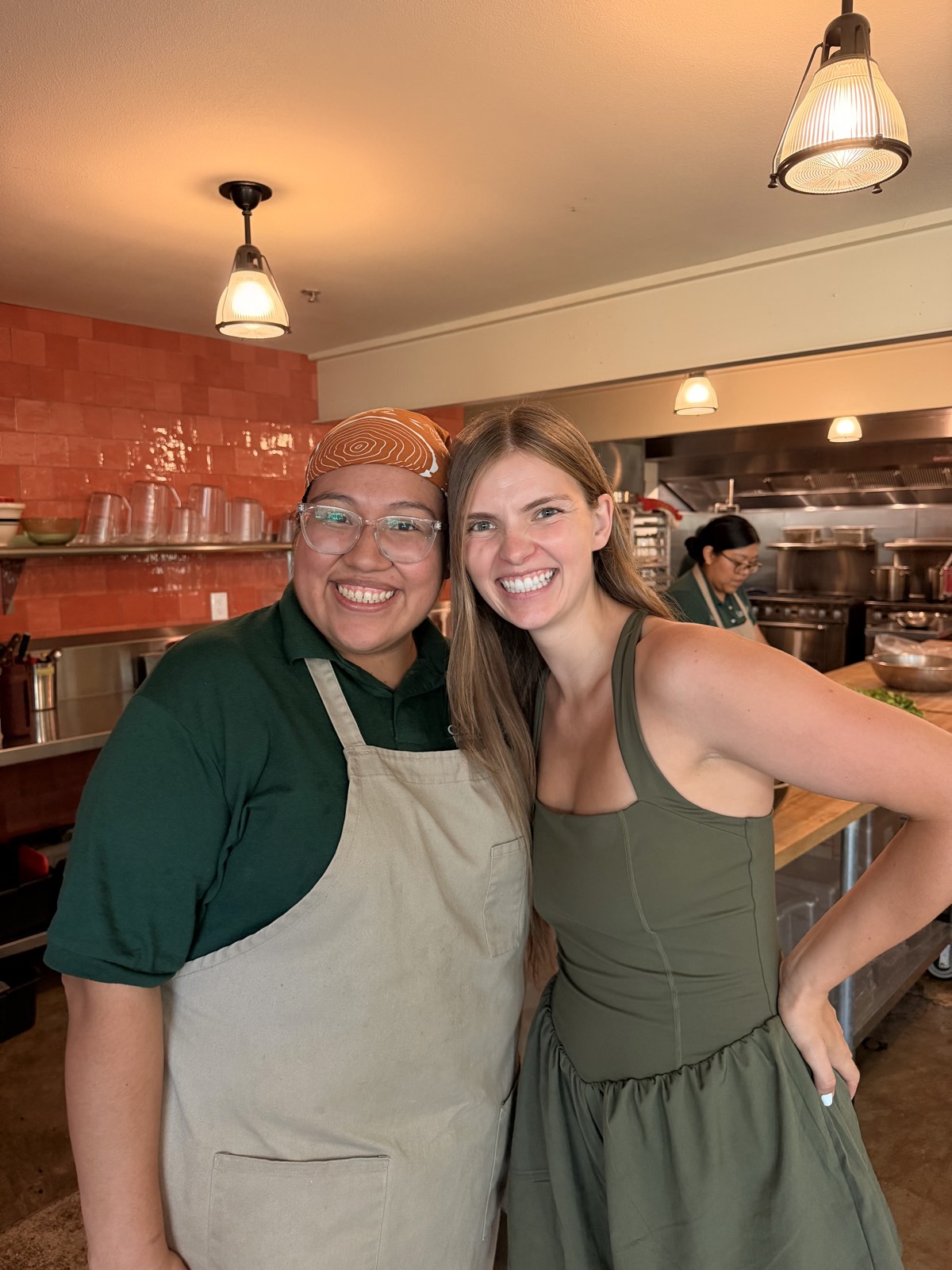 Gabby Martinez, owner and sous chef of Casa de Luz East, in the kitchen with the Vegan Wellness Retreats team
