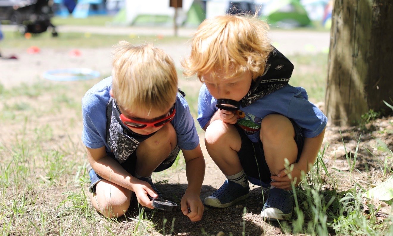 Two boys exploring nature together