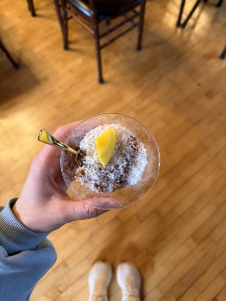 Vegan Wellness Retreats — a guest holding a fresh mocktail