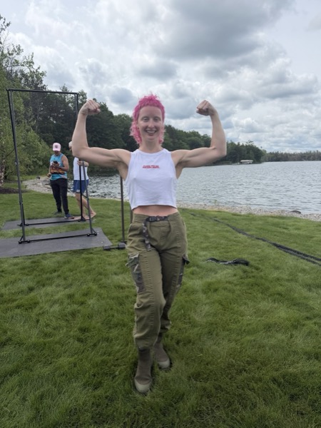 Vegan Wellness Retreats — a guest flexing after the retreat olympics