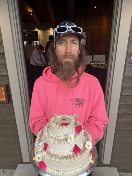 Vegan Wellness Retreats — a guest presenting a homemade layer cake