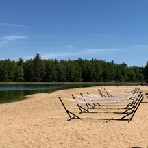 The sandy beach and hammocks at Timber Wolf Lake, Michigan