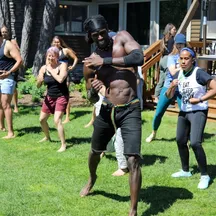 Guests in an outdoor group dance workout at a VWR retreat