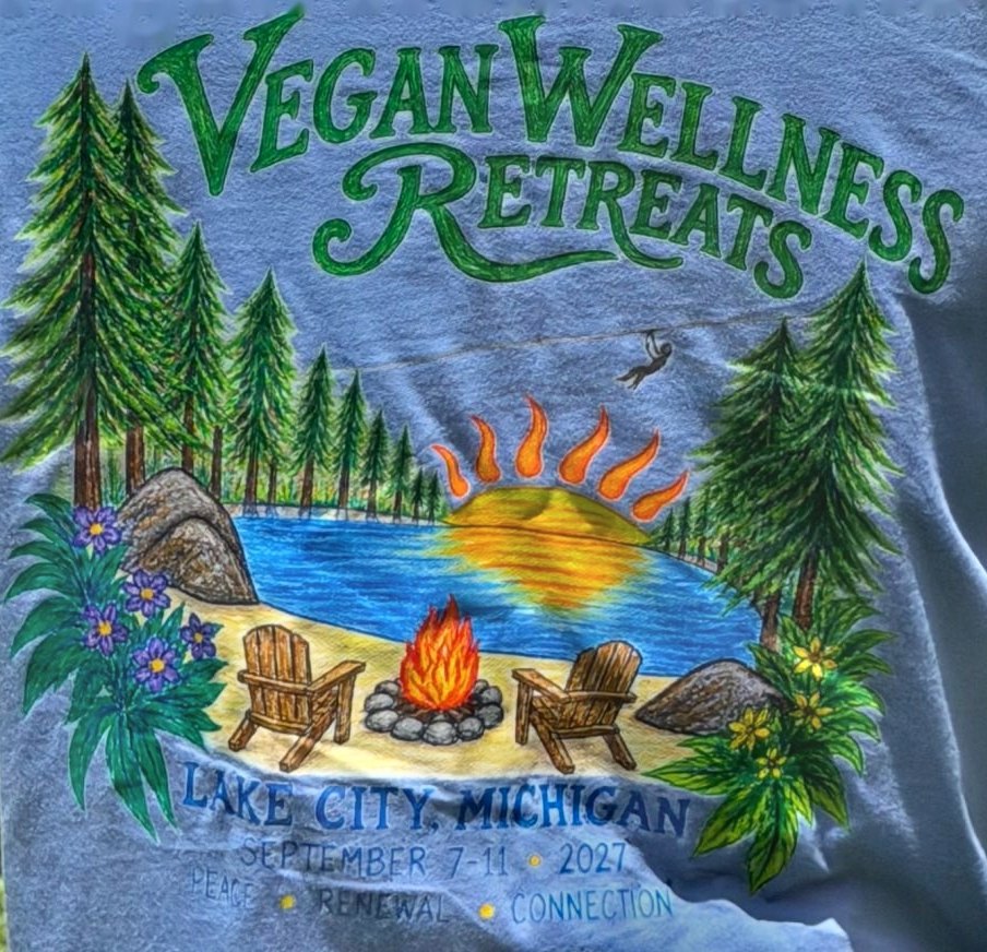 Back of the 2027 Vegan Wellness Retreats Michigan shirt — a hand-drawn lake, pines and campfire scene, Lake City, Michigan