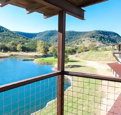 The lake and Hill Country at LoneHollow Ranch, seen from a balcony