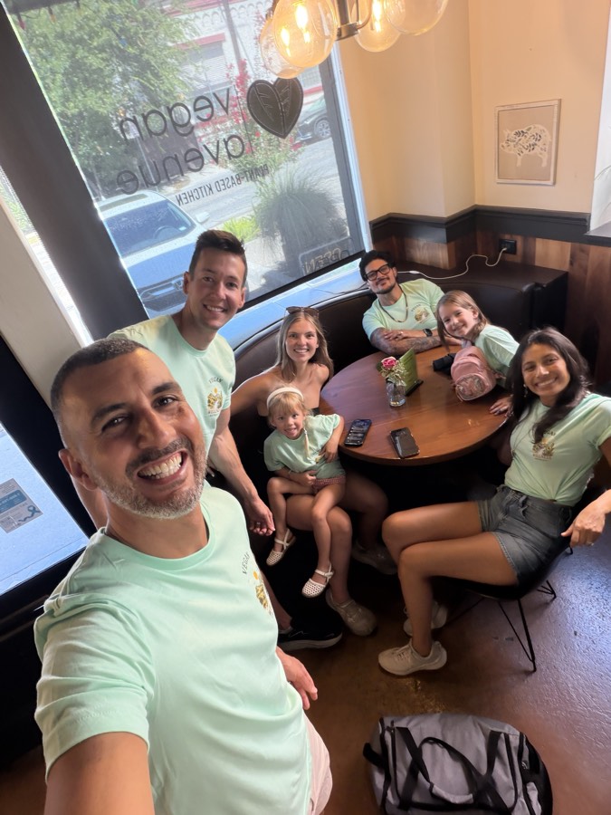 Members of the VWR team wearing the 2027 Texas shirt at a plant-based restaurant